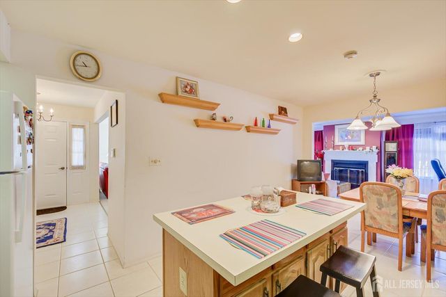 a kitchen with stainless steel appliances a sink a stove and cabinets