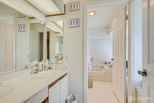 a bathroom with a sink toilet and bathtub