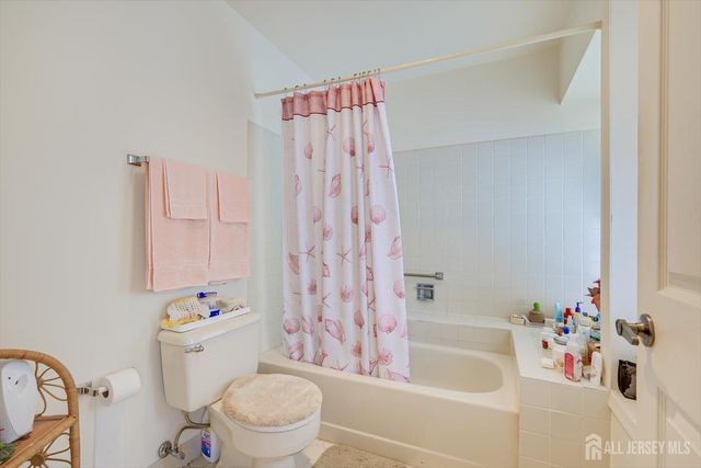 a bedroom with a bed and a table in it