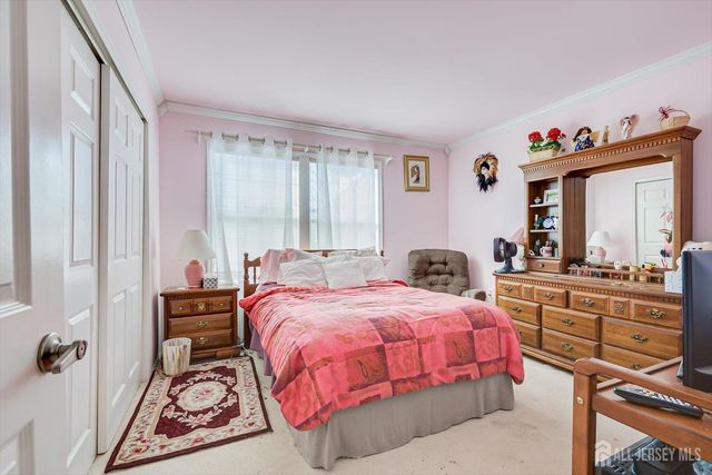 a bedroom with a bed and furniture