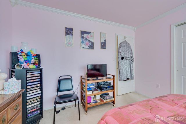 a bathroom with a sink toilet and a mirror