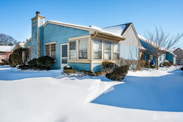 a view of a yard with snow on the road