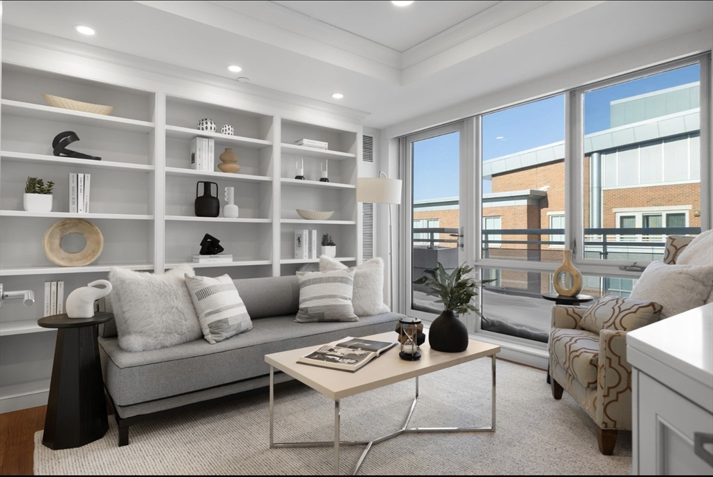 4 Battery Wharf, Unit PH 46 Boston, MA 02109 - Photo 13 of 39 a living room with furniture and a large window