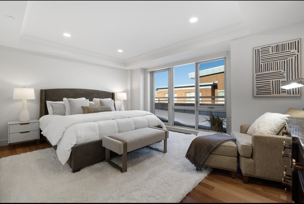 4 Battery Wharf, Unit PH 46 Boston, MA 02109 - Photo 15 of 39 a bedroom with a bed and a couch