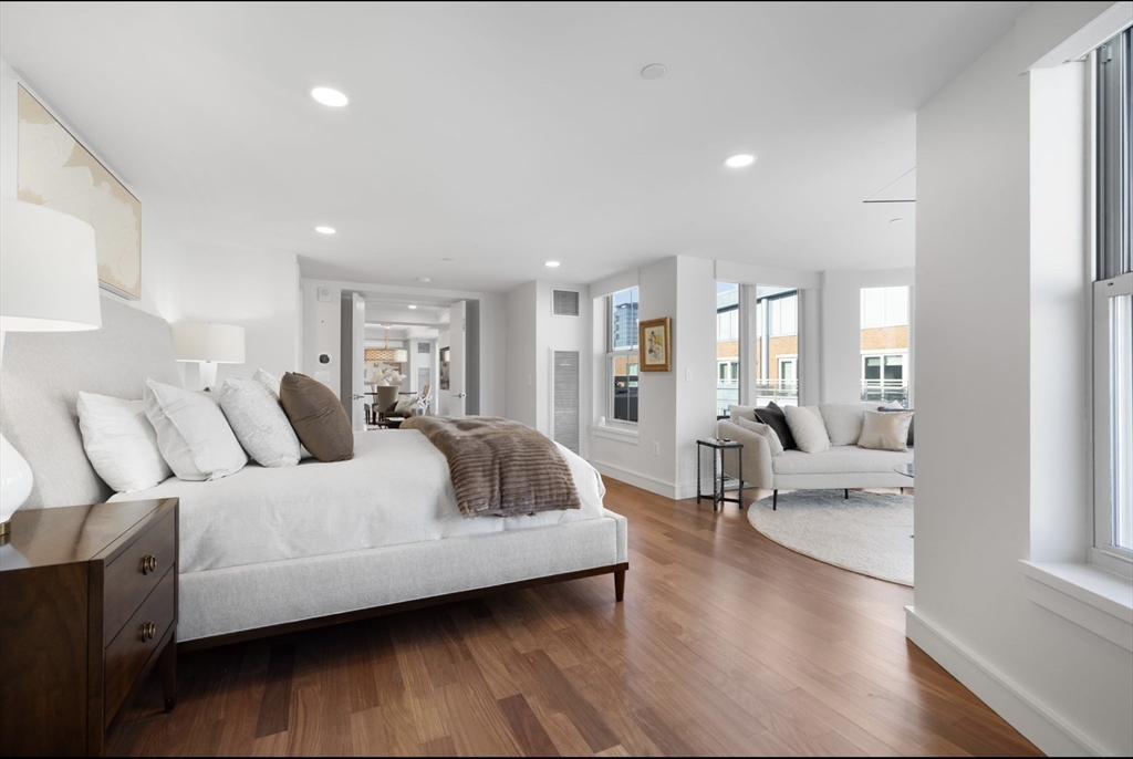 4 Battery Wharf, Unit PH 46 Boston, MA 02109 - Photo 20 of 39 a living room with furniture and a wooden floor