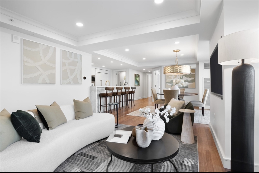 4 Battery Wharf, Unit PH 46 Boston, MA 02109 - Photo 2 of 39 a living room with furniture and a table