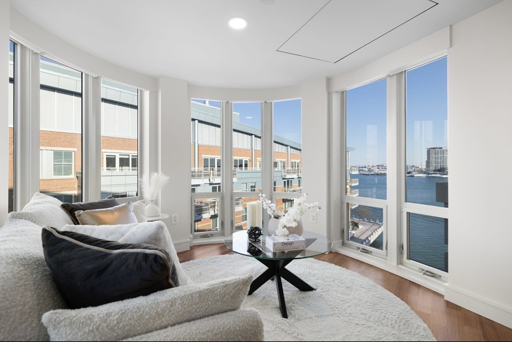 4 Battery Wharf, Unit PH 46 Boston, MA 02109 - Photo 23 of 39 a living room with furniture and a floor to ceiling window