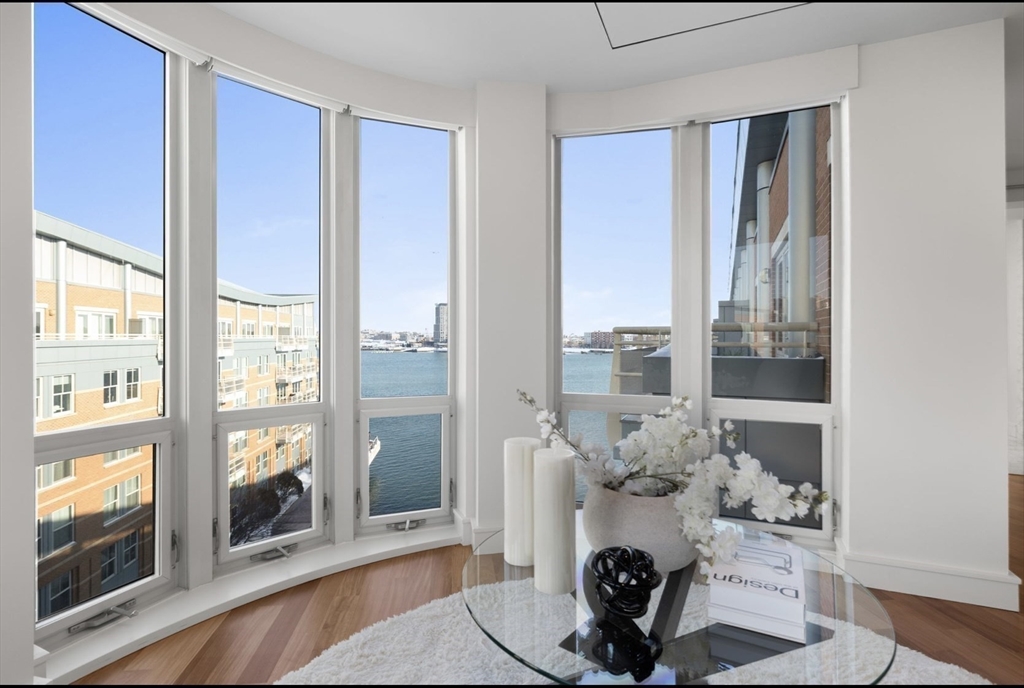 4 Battery Wharf, Unit PH 46 Boston, MA 02109 - Photo 25 of 39 a room with furniture and a window