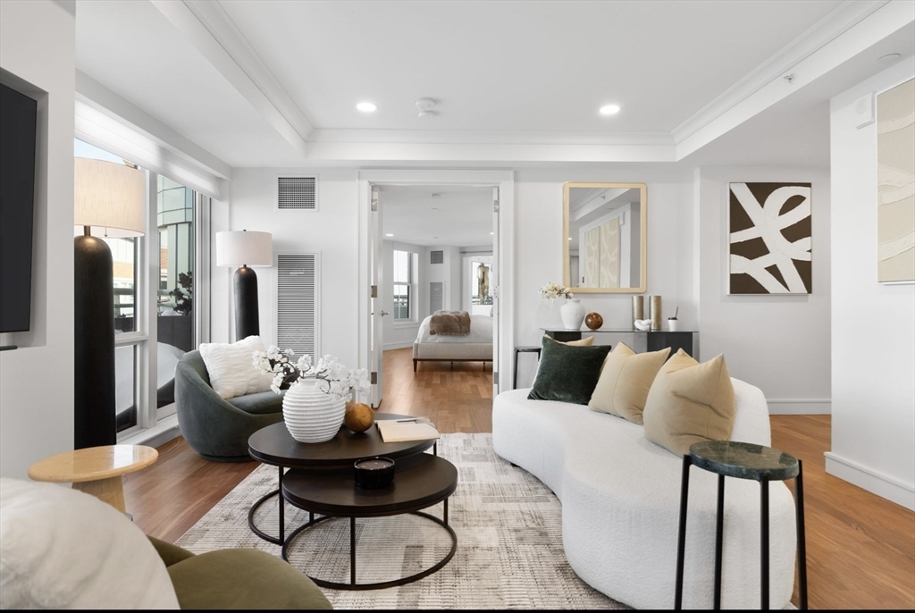 4 Battery Wharf, Unit PH 46 Boston, MA 02109 - Photo 4 of 39 a living room with furniture and large windows