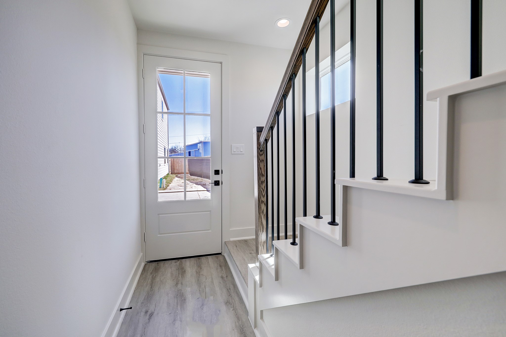 5242 Texas Street Houston, TX 77011 - Photo 5 of 27 a view of a hallway with entryway and stairs