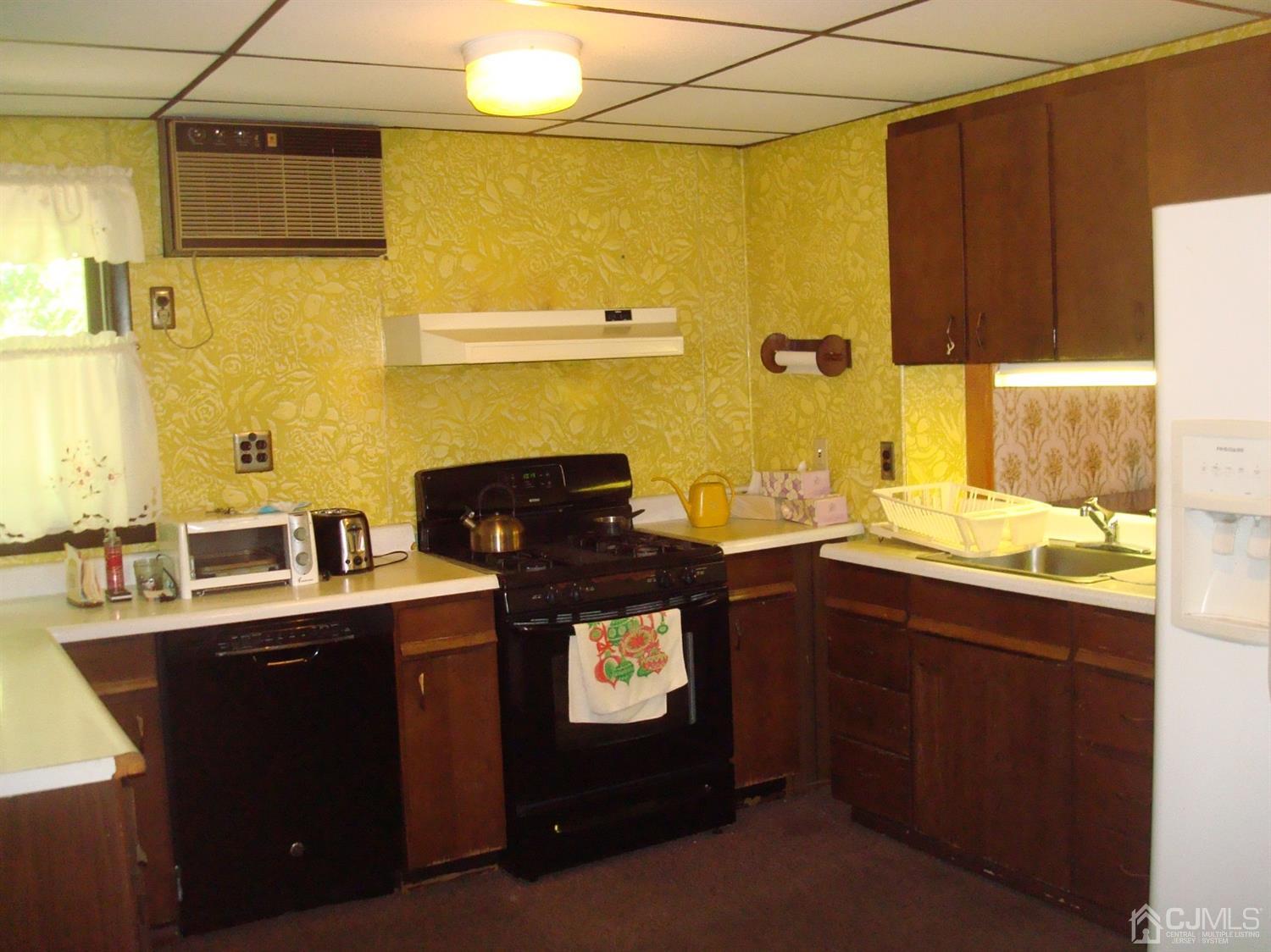 7 James Road East Brunswick, NJ 08816 - Photo 2 of 21 a kitchen with a sink and cabinets