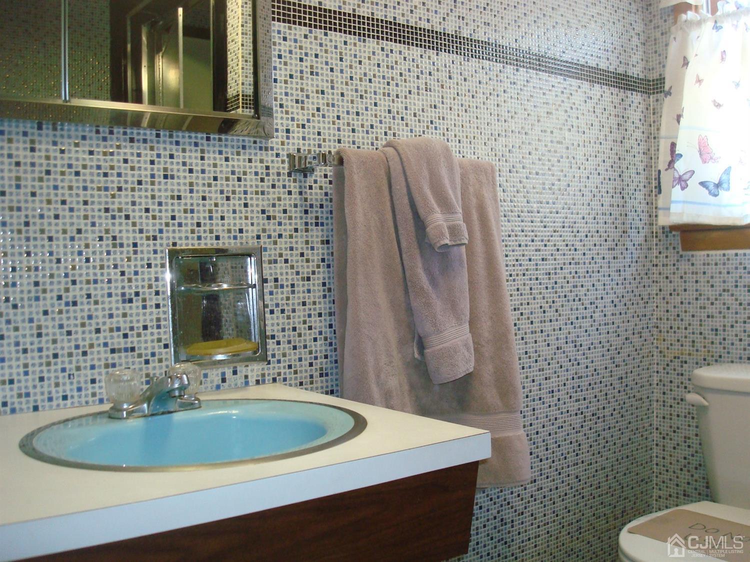 7 James Road East Brunswick, NJ 08816 - Photo 13 of 21 a bathroom with a sink a toilet and a mirror