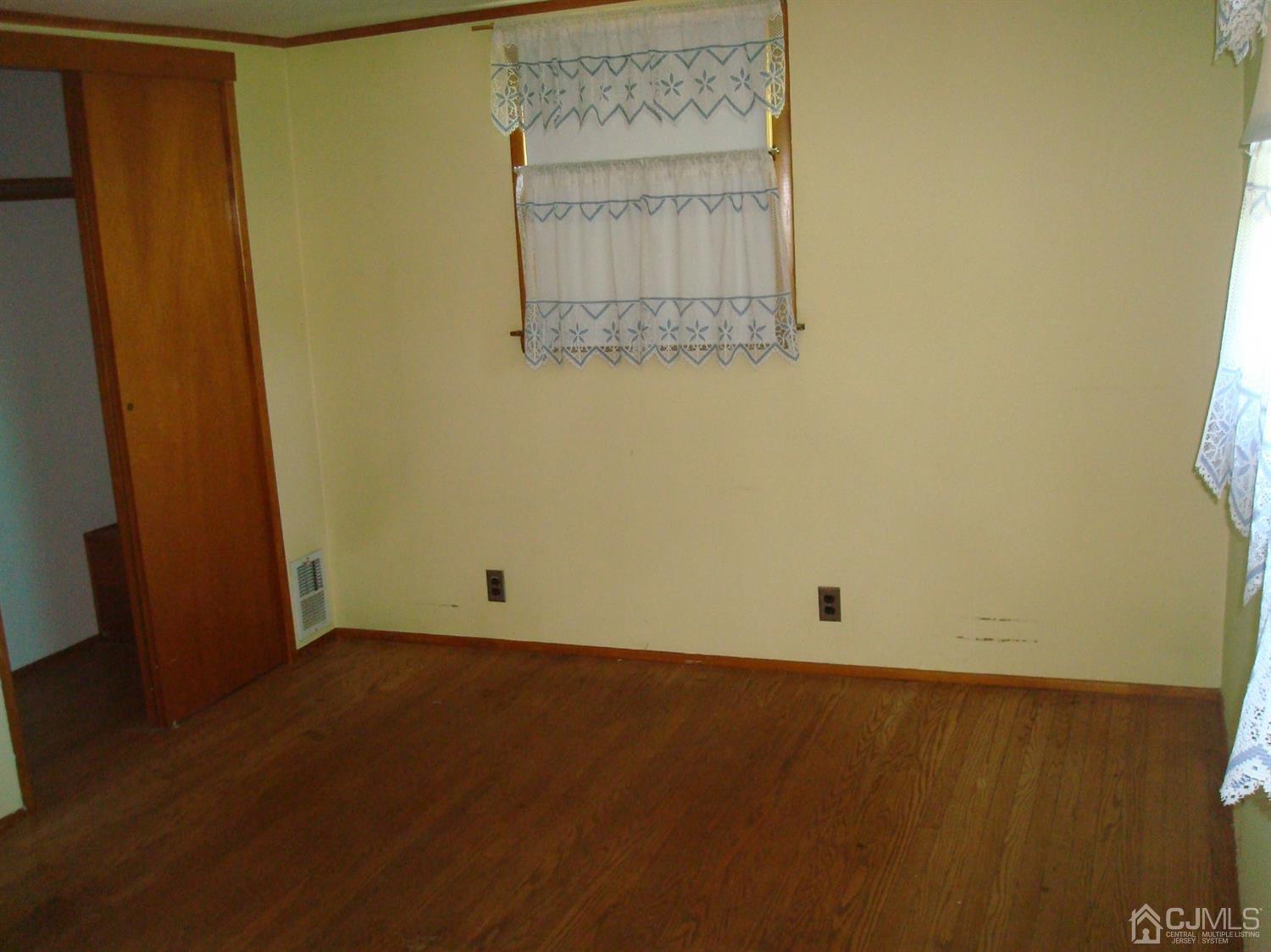 7 James Road East Brunswick, NJ 08816 - Photo 15 of 21 an empty room with a wooden door