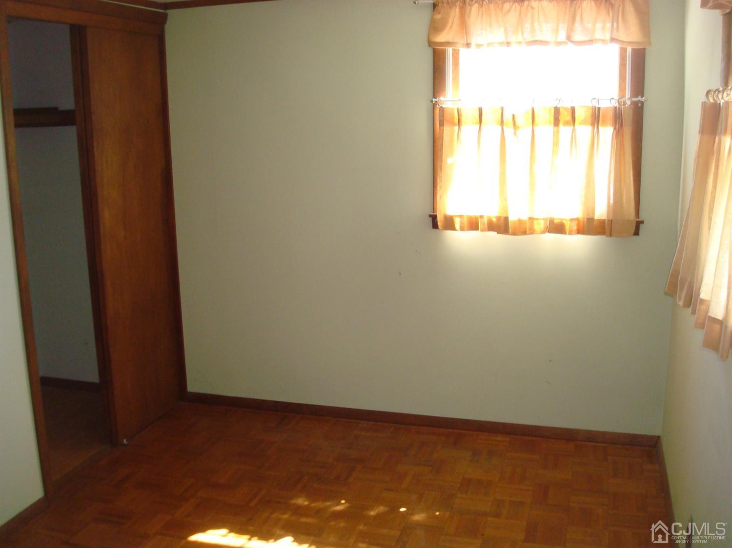 7 James Road East Brunswick, NJ 08816 - Photo 16 of 21 a view of an empty room and window