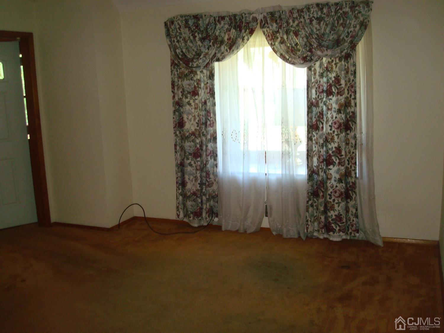 7 James Road East Brunswick, NJ 08816 - Photo 6 of 21 an empty room with windows