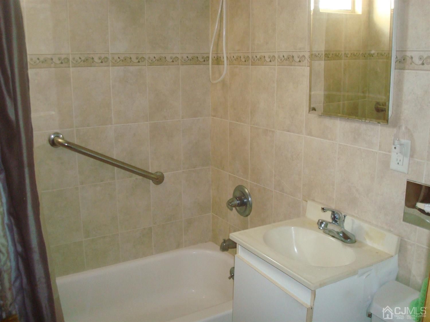 7 James Road East Brunswick, NJ 08816 - Photo 8 of 21 a bathroom with a sink and a shower