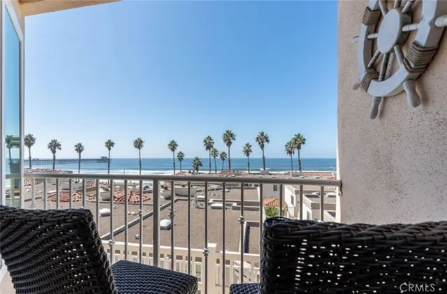 a view of a balcony with chairs