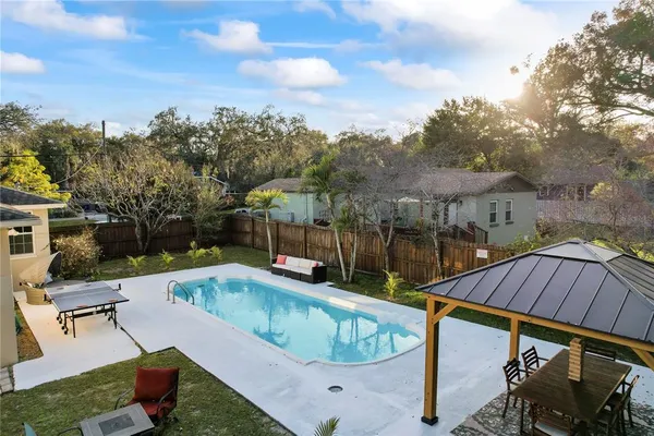 a view of a swimming pool with a patio