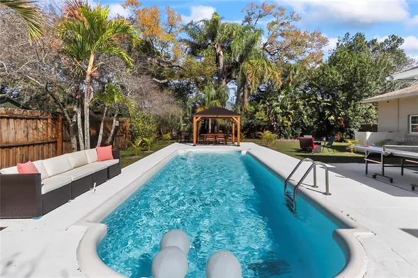 a view of a swimming pool with a patio