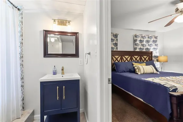 a bedroom with a bed and a table in it