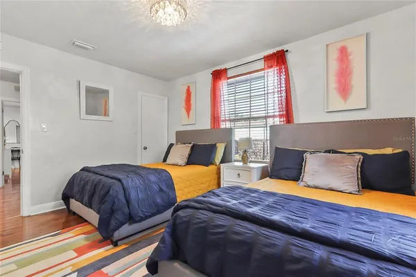 a bedroom with bed and window