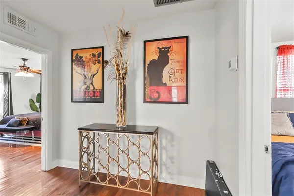a view of room with furniture and wooden floor