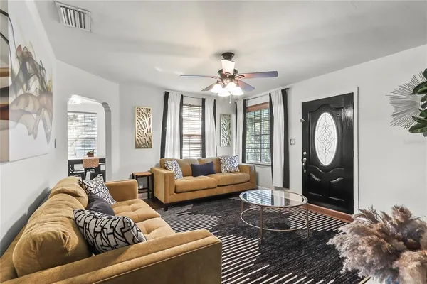a living room with furniture and a large window