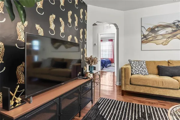 a living room with furniture and a fireplace