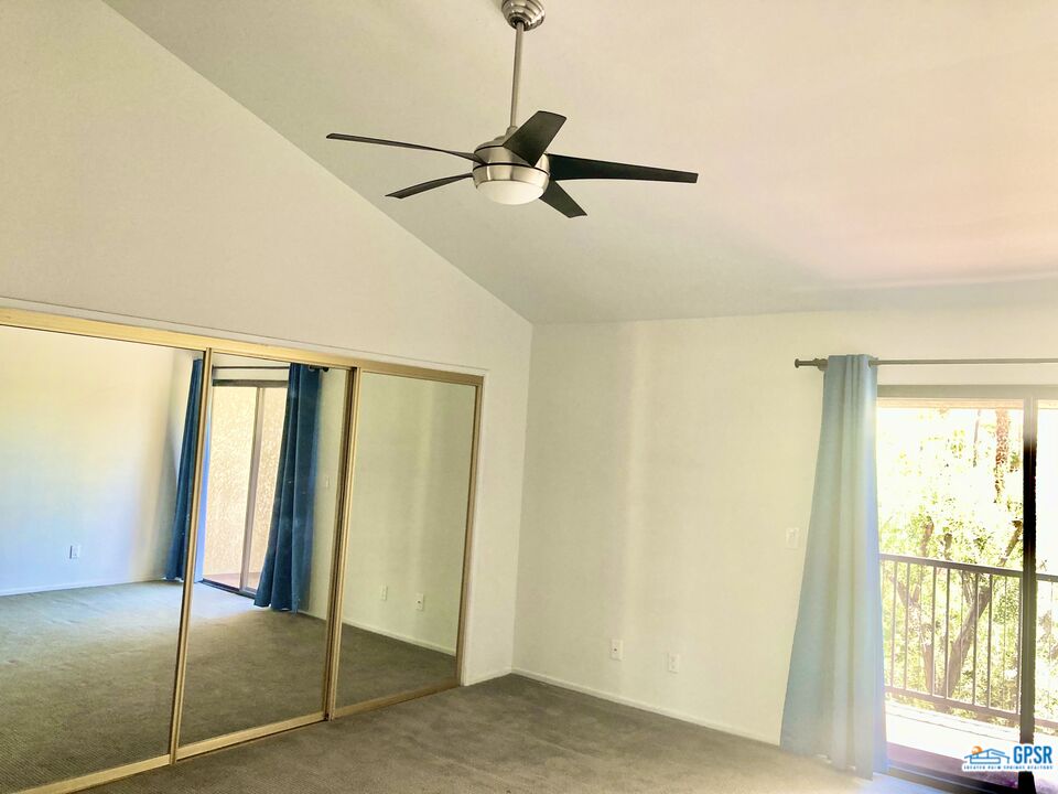 3155 Ramon Road, Unit 804 Palm Springs, CA 92264 - Photo 7 of 8 a view of an empty room with a window