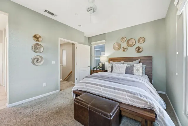 a bedroom with a bed and a table in it