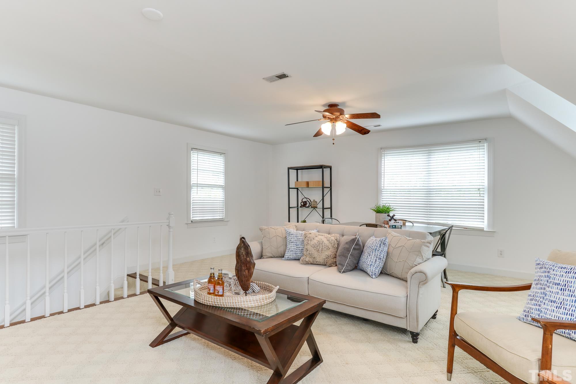 8913 Lindenshire Road Raleigh, NC 27615 - Photo 18 of 27 a living room with furniture and a window