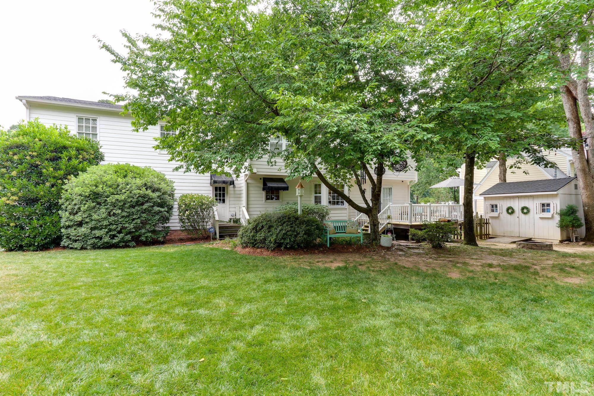 8913 Lindenshire Road Raleigh, NC 27615 - Photo 26 of 27 a view of a house with a big yard and large trees