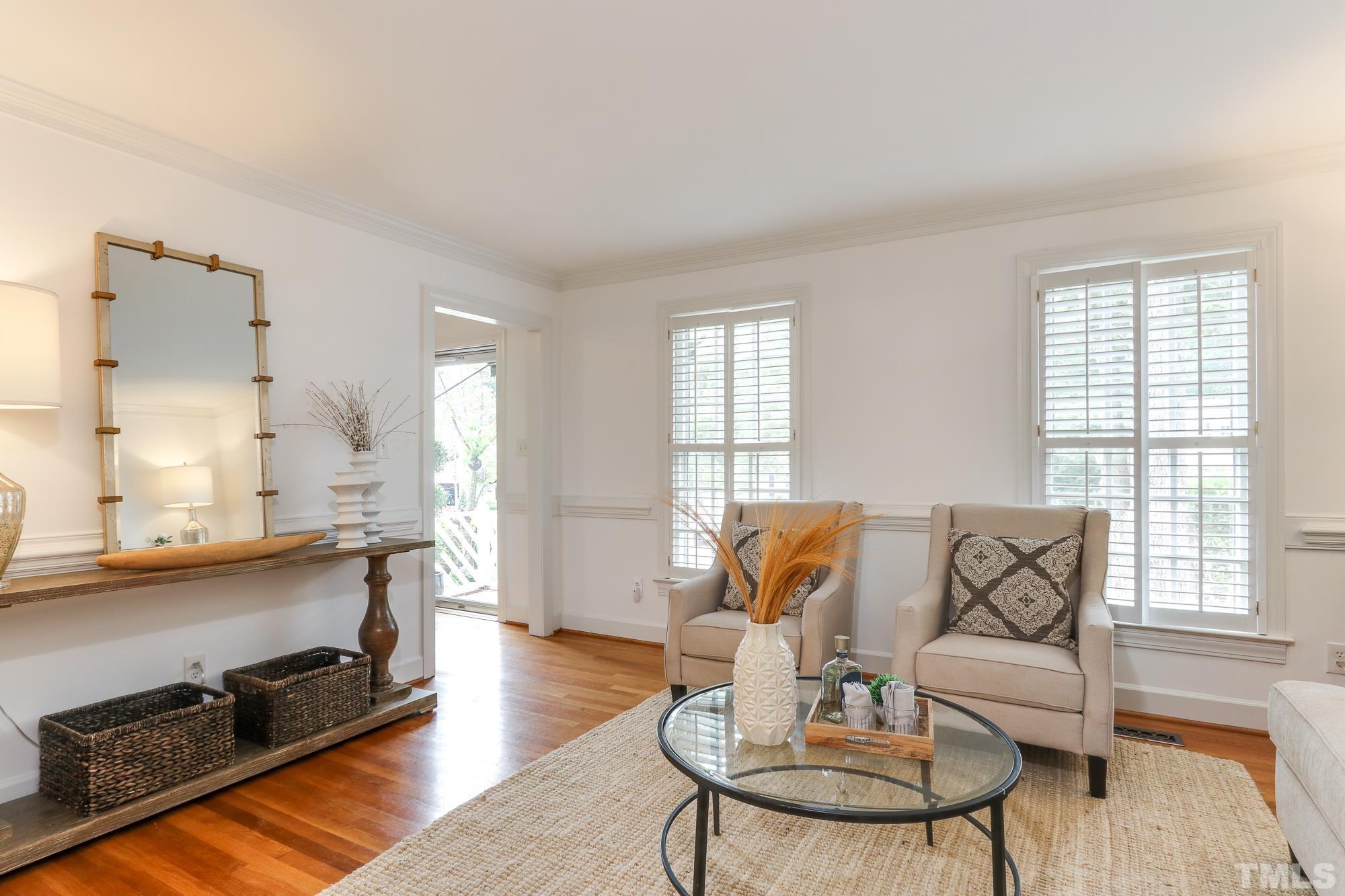 8913 Lindenshire Road Raleigh, NC 27615 - Photo 8 of 27 a living room with furniture and wooden floor