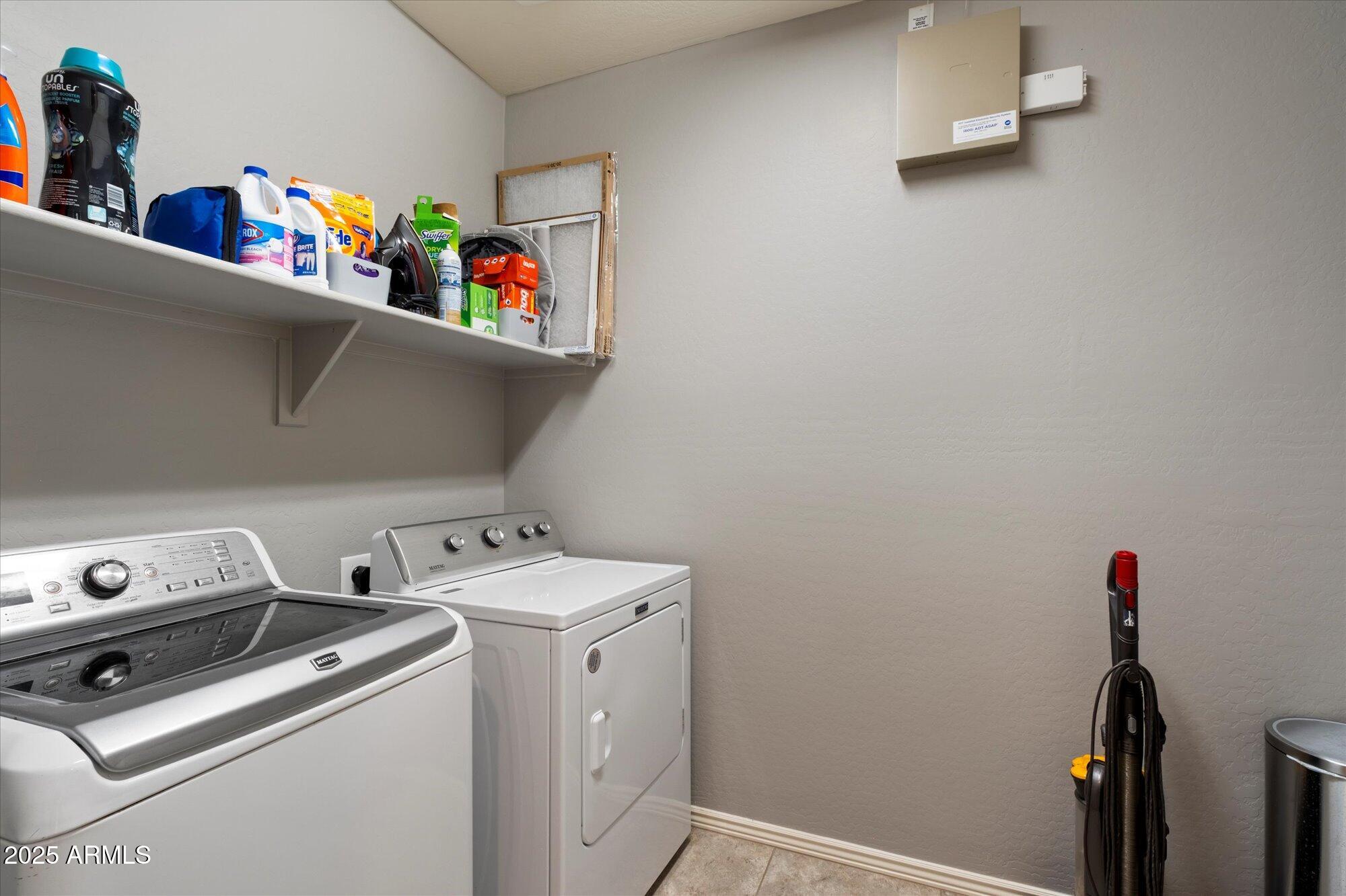5123 South Mariposa Drive Gilbert, AZ 85298 - Photo 23 of 35 a utility room with dryer washer and shoe rack