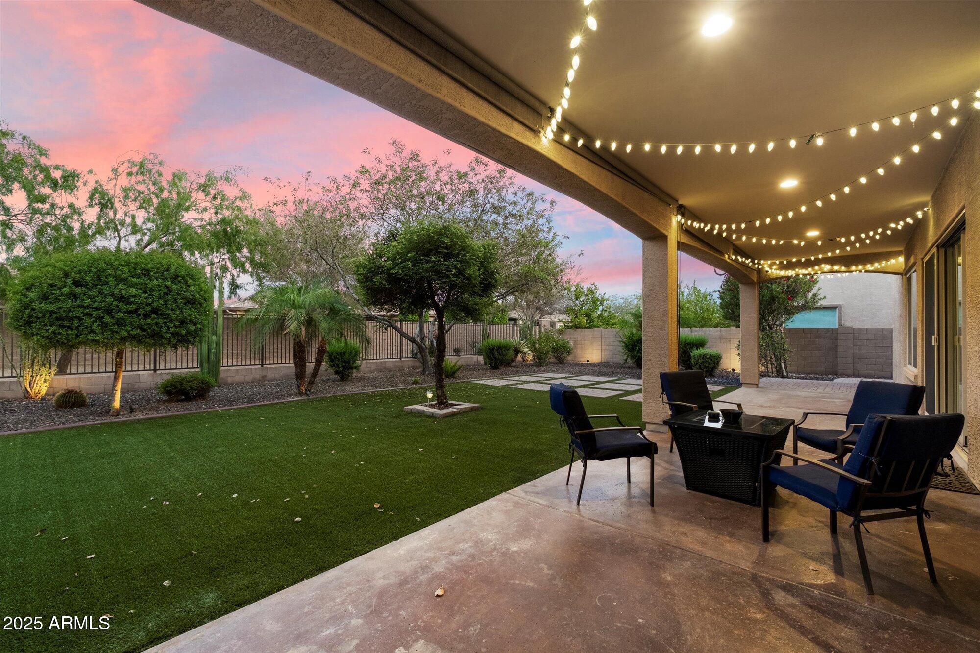 5123 South Mariposa Drive Gilbert, AZ 85298 - Photo 24 of 35 a patio with yard a table and chairs