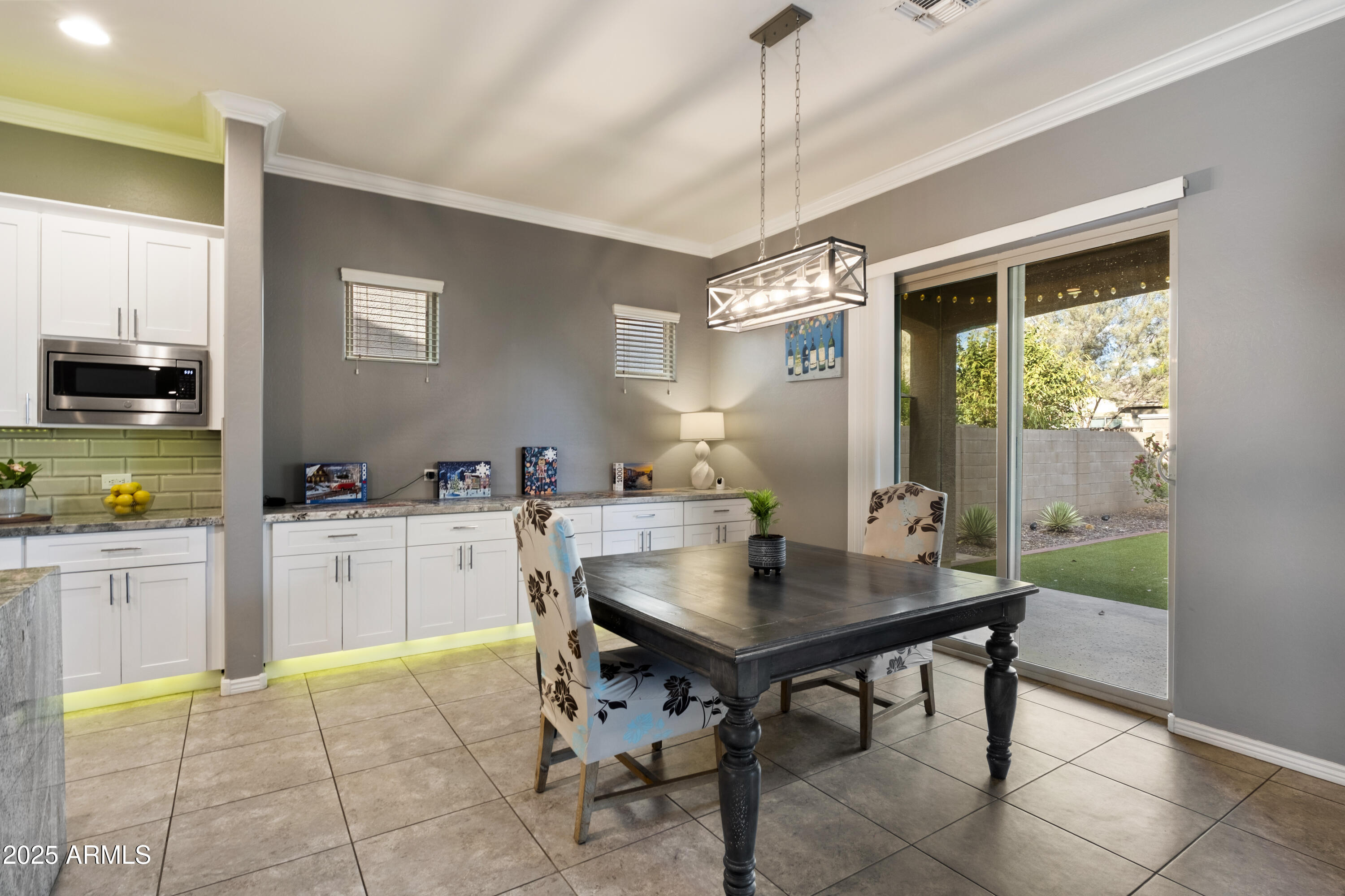 5123 South Mariposa Drive Gilbert, AZ 85298 - Photo 7 of 35 a kitchen with a table and chairs in it