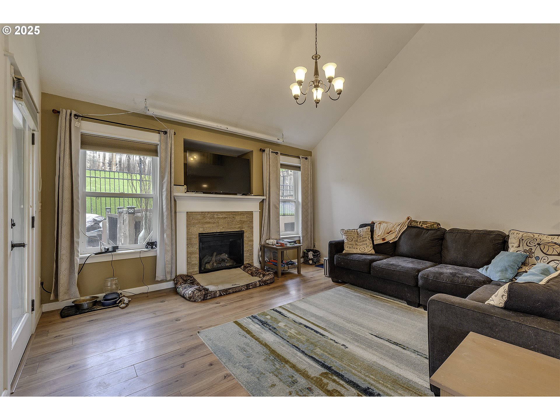 35505 Iris Way St. Helens, OR 97051 - Photo 4 of 17 a living room with furniture a fireplace and a flat screen tv