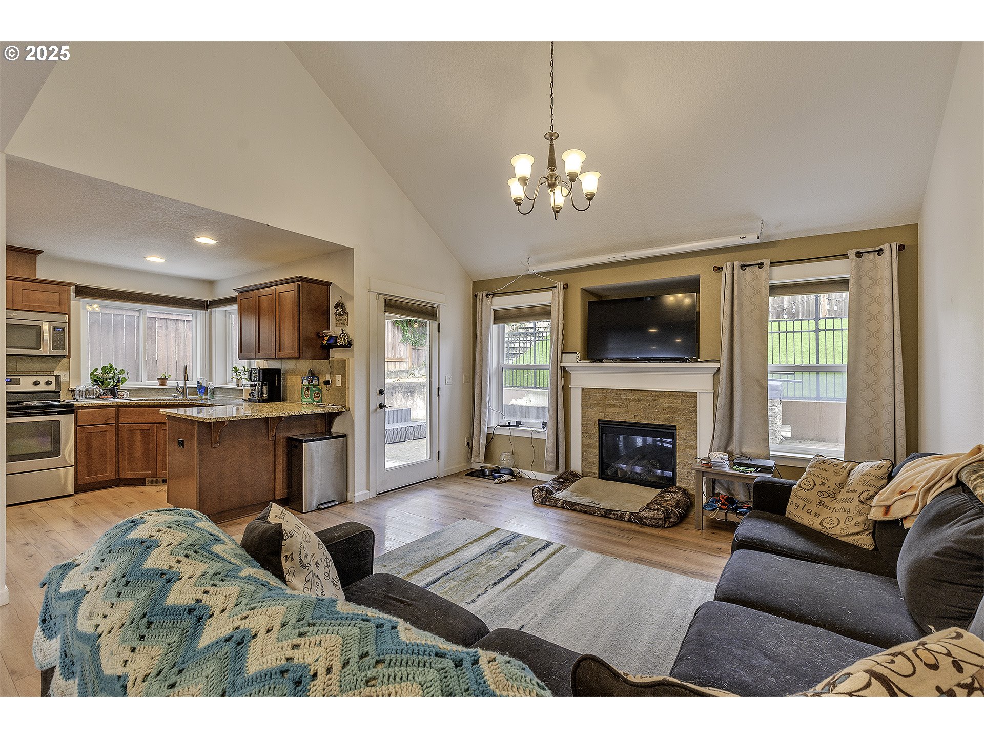 35505 Iris Way St. Helens, OR 97051 - Photo 5 of 17 a living room with furniture fireplace and kitchen view