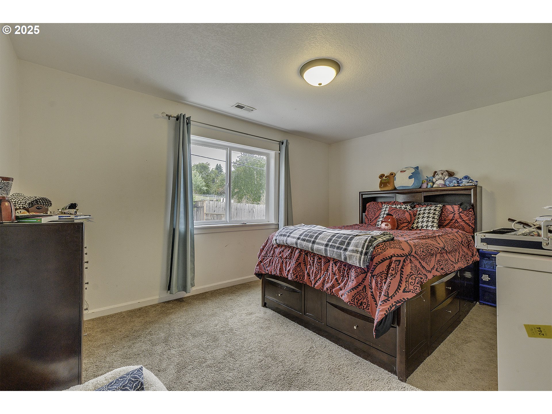35505 Iris Way St. Helens, OR 97051 - Photo 9 of 17 a bed sitting in a bedroom next to a window