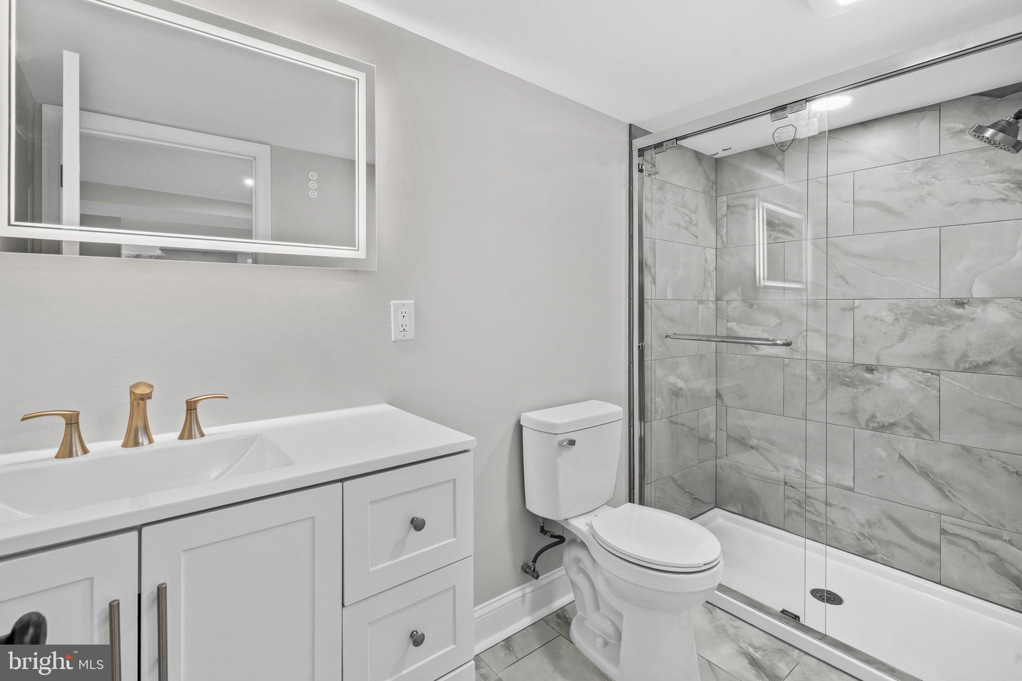 1082 Edge Hill Road Abington, PA 19001 - Photo 28 of 37 a bathroom with a sink a toilet and shower