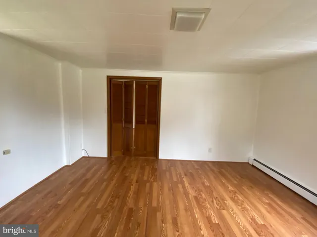 a view of small space with wooden floor