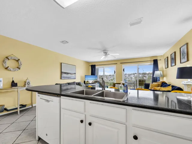 a kitchen with stainless steel appliances granite countertop a sink and cabinets