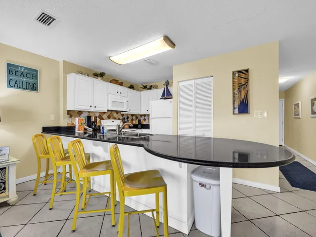 a kitchen with a sink cabinets and window