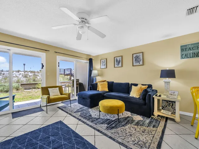 a living room with furniture and a rug