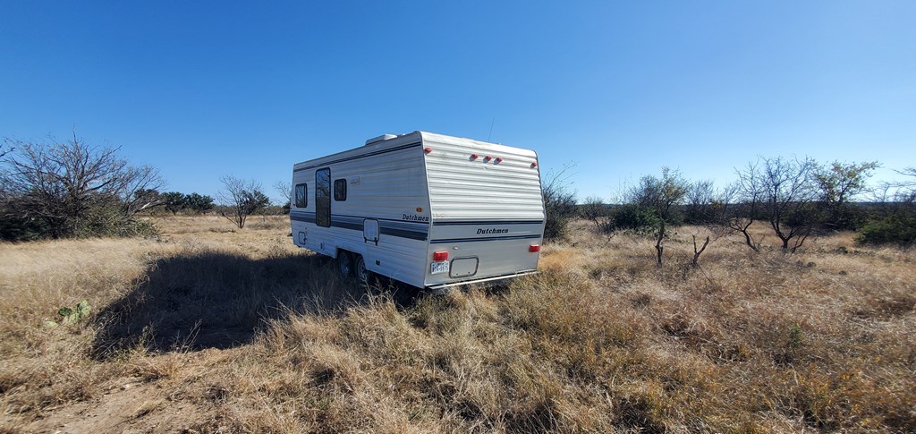 54 Dry Creek Road, Unit 54 Fort McKavett, TX 76841 - Photo 13 of 16 a view of a house with a yard
