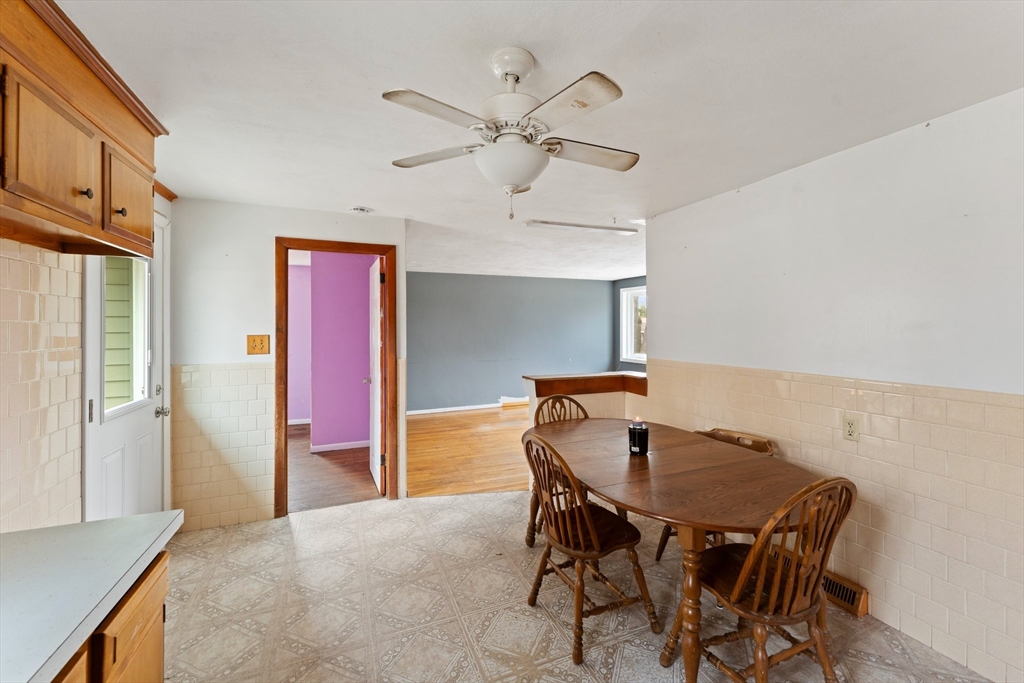 38 Orton Street Worcester, MA 01604 - Photo 11 of 37 a view of a dining room with furniture and a chandelier fan