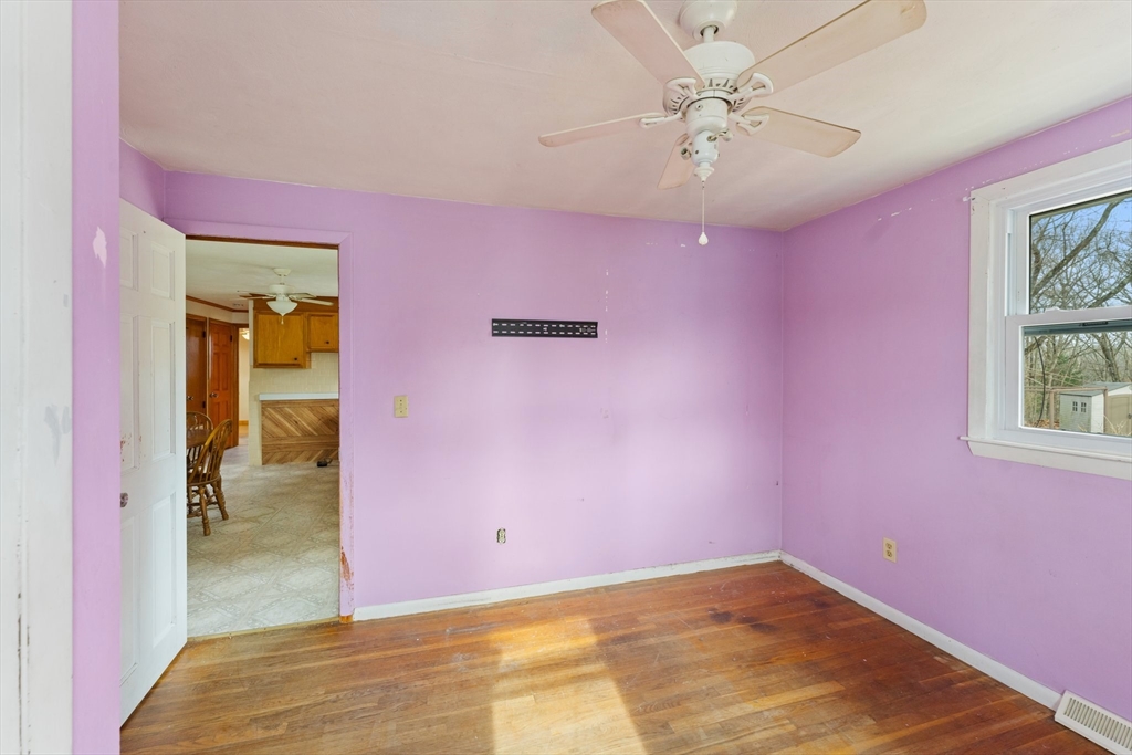 38 Orton Street Worcester, MA 01604 - Photo 14 of 37 a view of a livingroom with a chandelier fan and windows