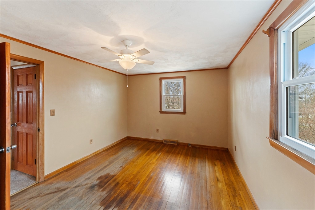 38 Orton Street Worcester, MA 01604 - Photo 15 of 37 wooden floor in an empty room with a window