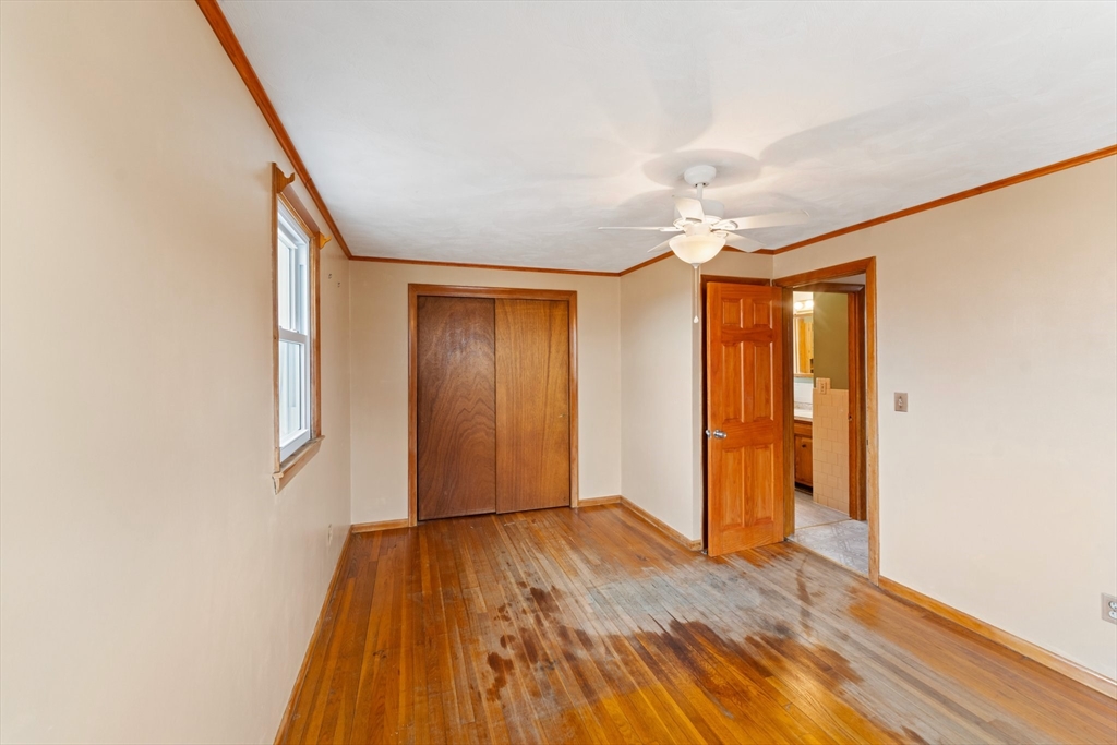 38 Orton Street Worcester, MA 01604 - Photo 16 of 37 a view of an empty room with wooden floor and a window