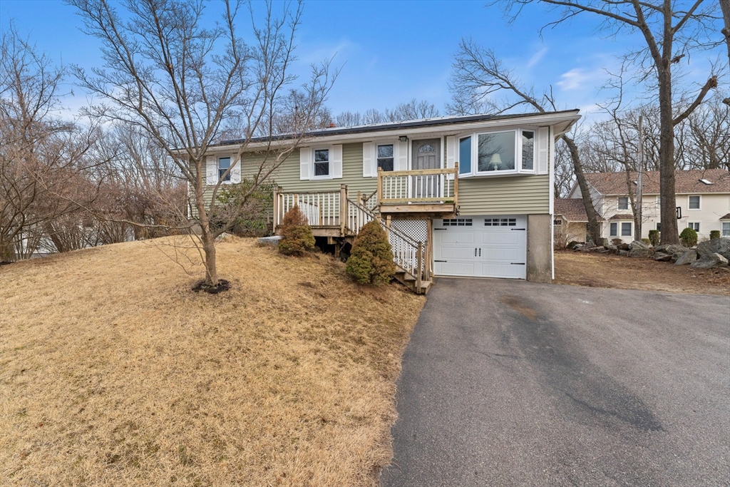 38 Orton Street Worcester, MA 01604 - Photo 24 of 37 a view of a house with a yard covered in snow